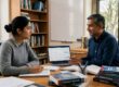 PhD scholar receiving research consultation services from an expert consultant at a desk