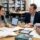 Research consulting services session with a PhD scholar and consultant reviewing a thesis draft